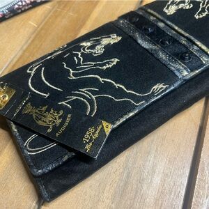 Christian Audigier vintage clutch with embroidered panthers.